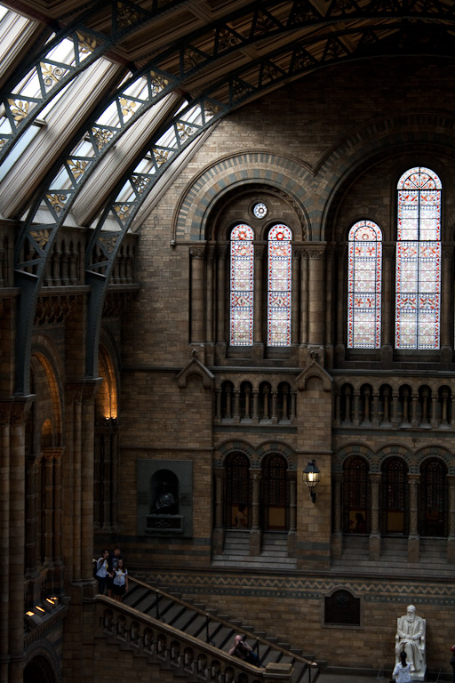 The interior of the Natural History Museum with a statue of Charles Darwin in the middle