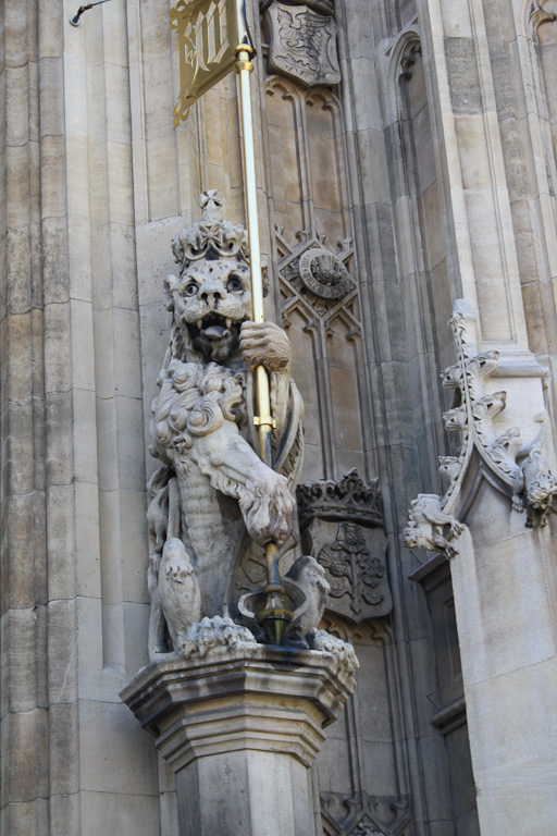A lion bearing a flag by the entrance to Westminster