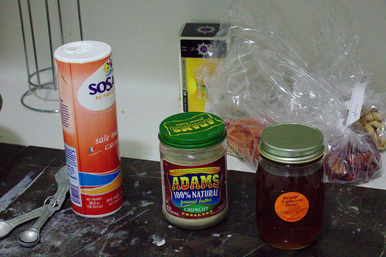 Salt, yeast, and honey standing on the counter