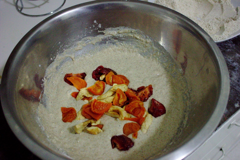 Dough in a batter-like consistency with chopped dried fruit