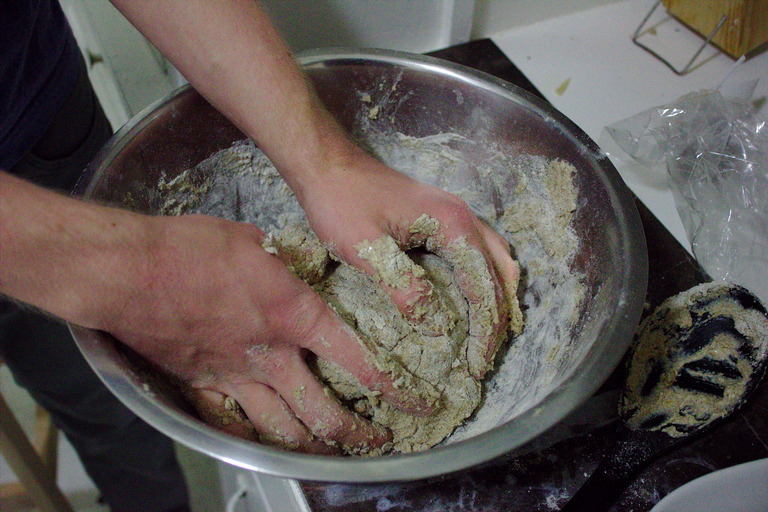 Hands kneading the dough