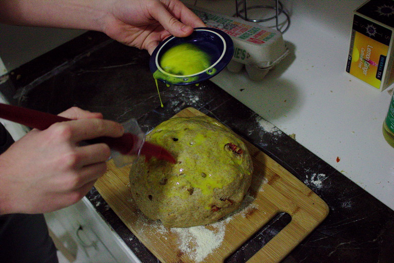 The dough being painted with egg yolk
